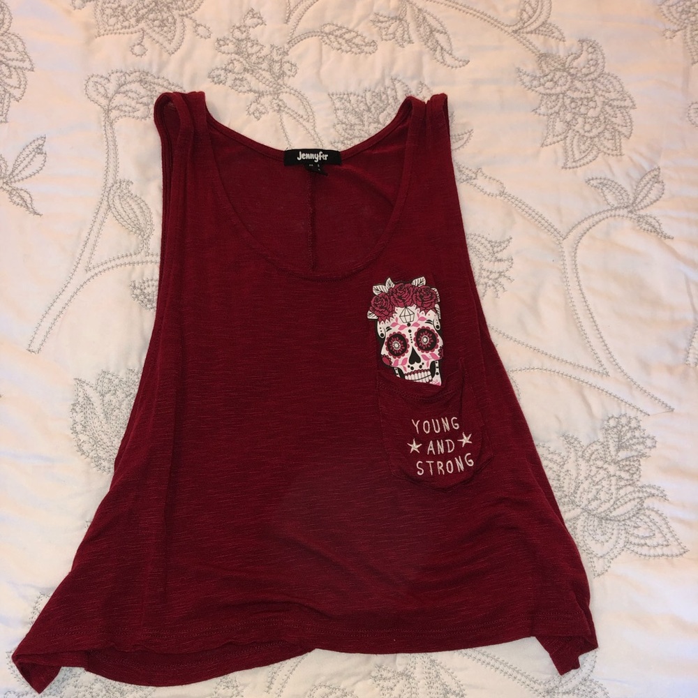 A rouge top with a front pocket